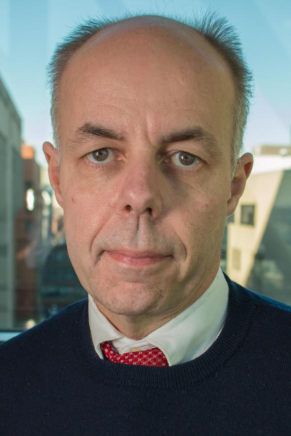 A man with a red tie and white shirt.